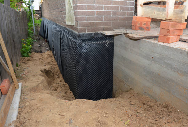 Happy homeowners after waterproofing job in Chunchula
